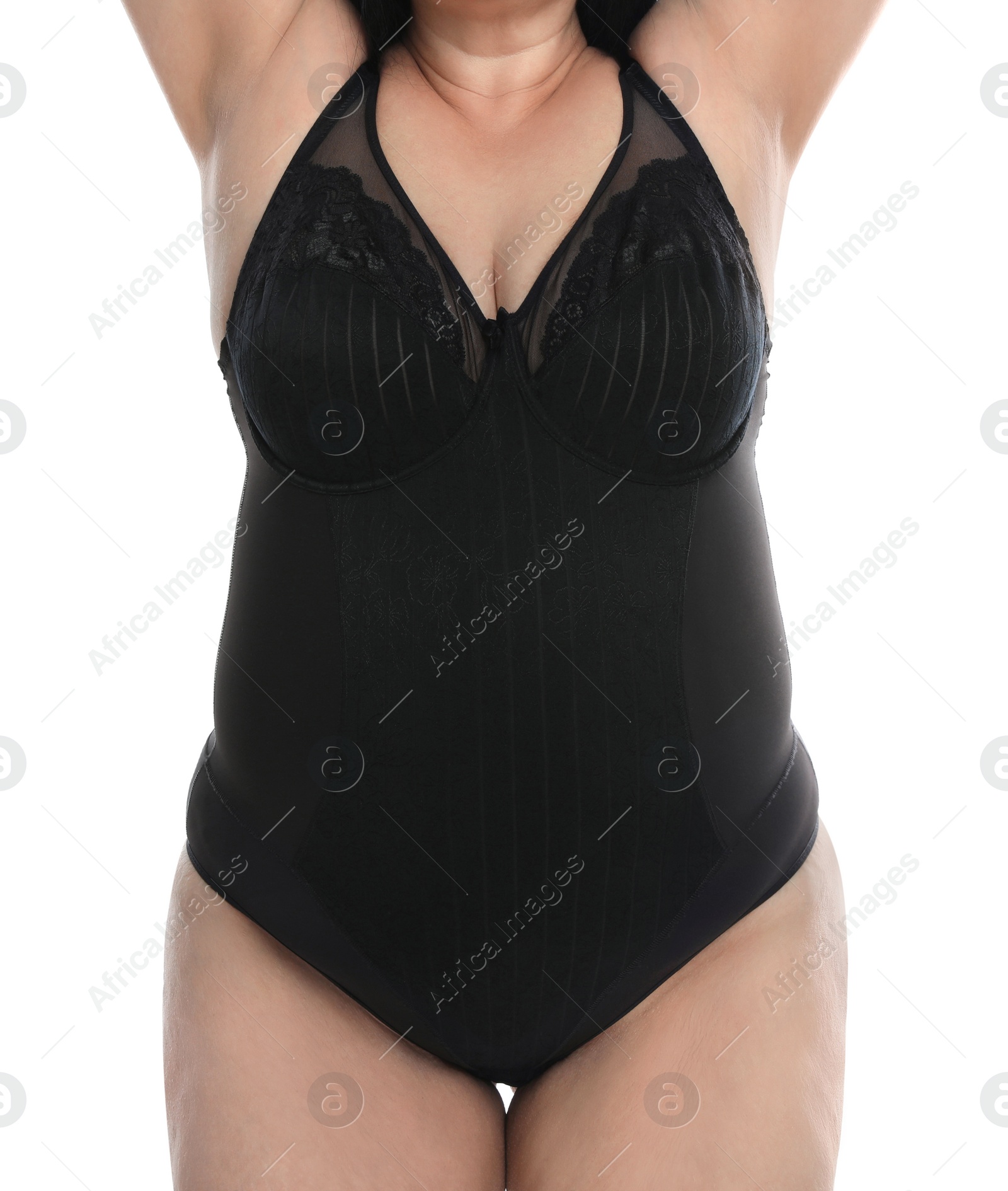 Photo of Overweight woman in black underwear on white background, closeup. Plus-size model