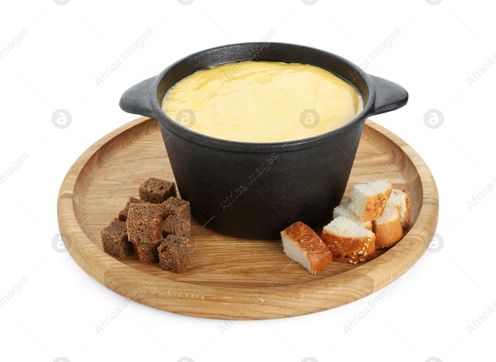 Photo of Fondue with tasty melted cheese and pieces of bread isolated on white