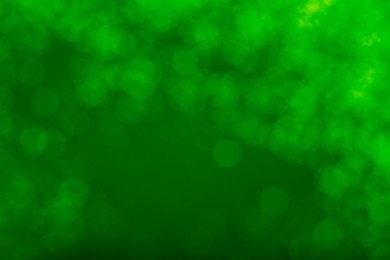 Image of St. Patrick day. Green background with blurred lights, bokeh effect