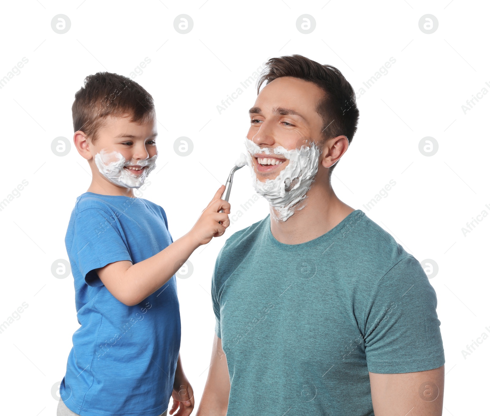 Photo of Little son shaving his dad on white background