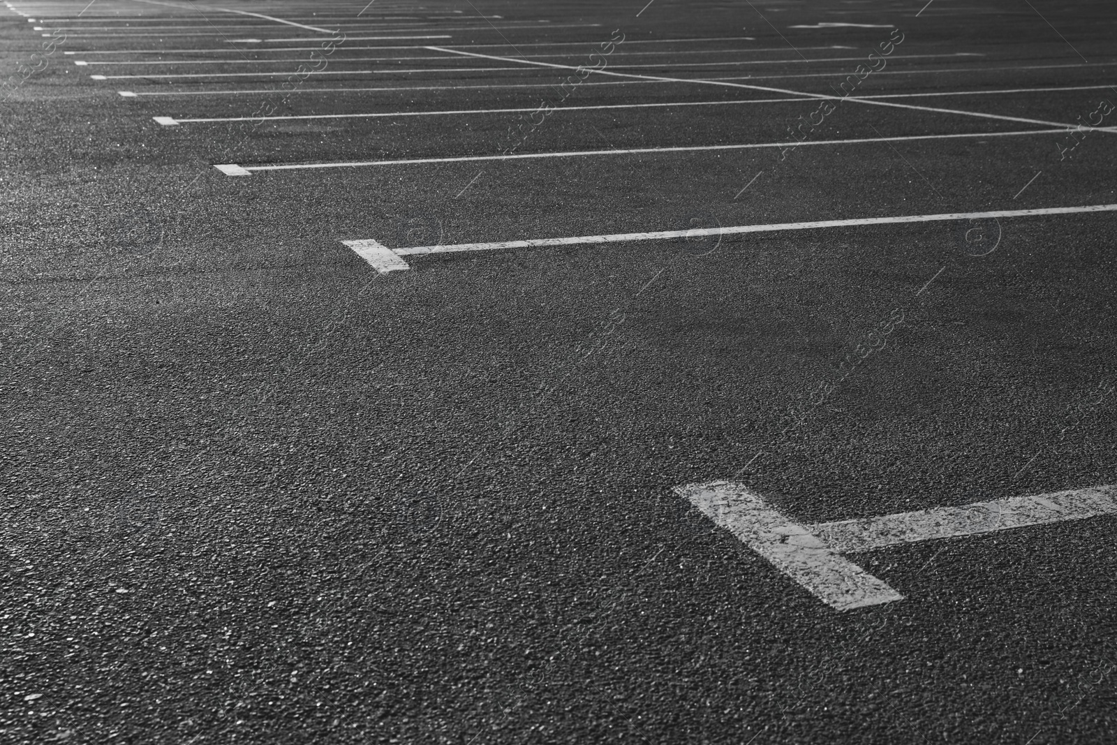 Photo of Car parking lot with white marking outdoors