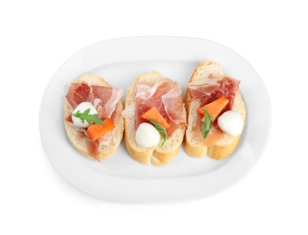 Photo of Sandwiches with fresh melon, prosciutto and mozzarella on white background, top view