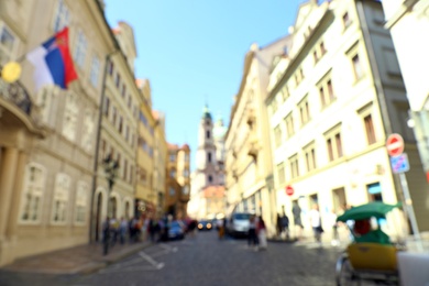 Photo of PRAGUE, CZECH REPUBLIC - APRIL 25, 2019: Blurred view of city street with old buildings