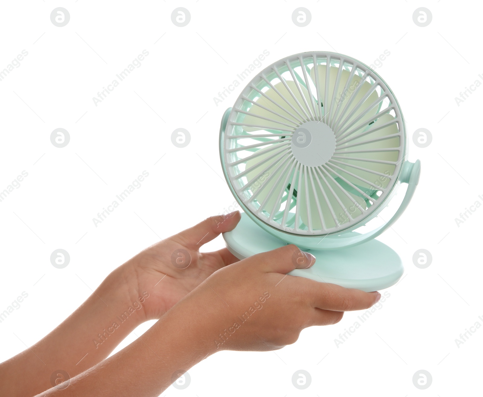 Photo of Little child with portable fan on white background, closeup. Summer heat