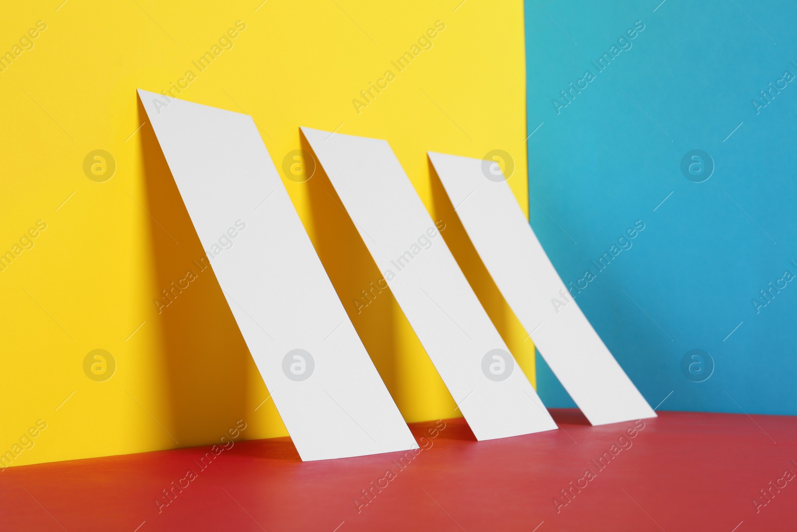 Photo of Empty sheets on color background. Mockup for design