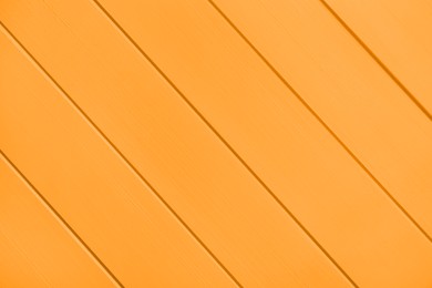 Image of Texture of orange wooden surface, top view