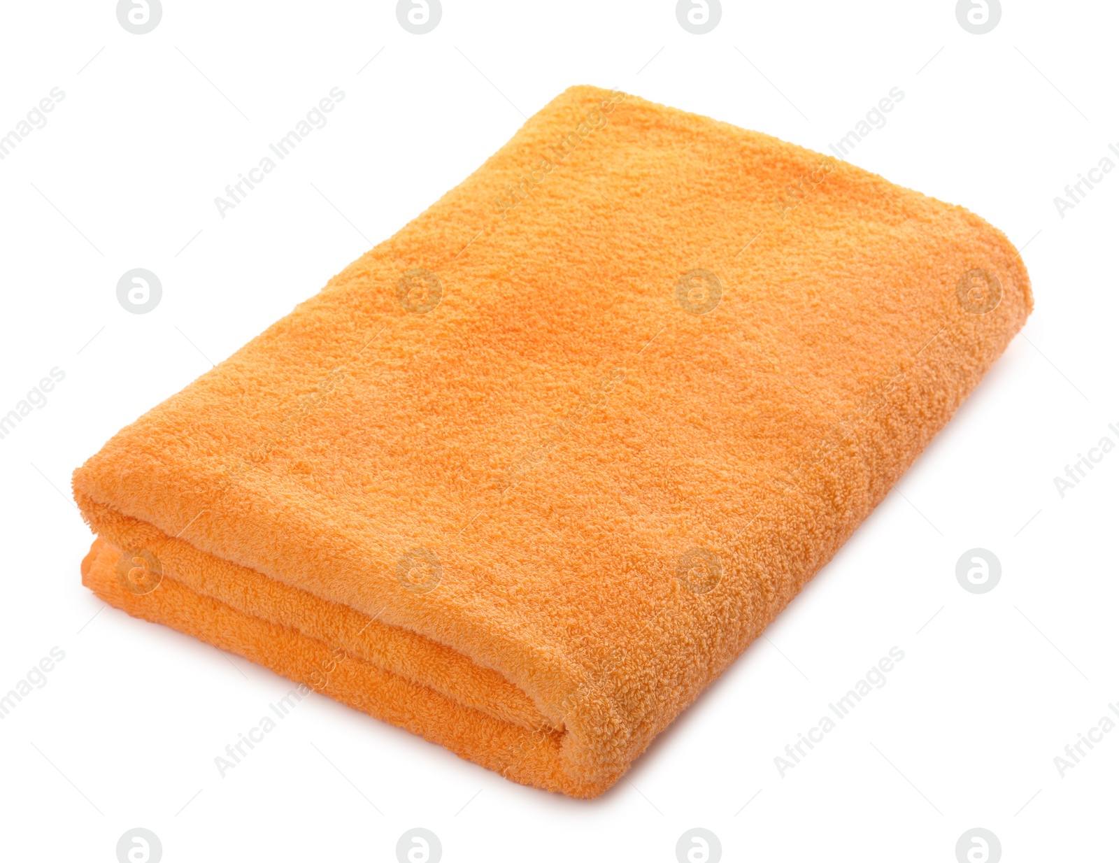 Photo of Folded orange beach towel isolated on white