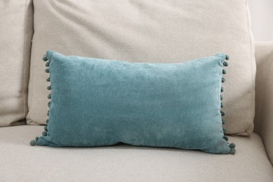 Photo of Soft pillows on beige sofa in room