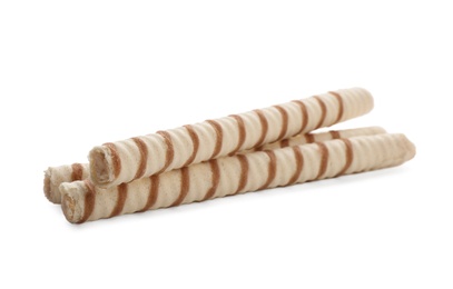 Tasty wafer roll sticks on white background. Crispy food