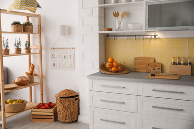 Photo of Modern kitchen interior with stylish white furniture