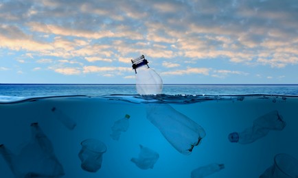 Image of Different plastic garbage in ocean, banner design. Environmental pollution