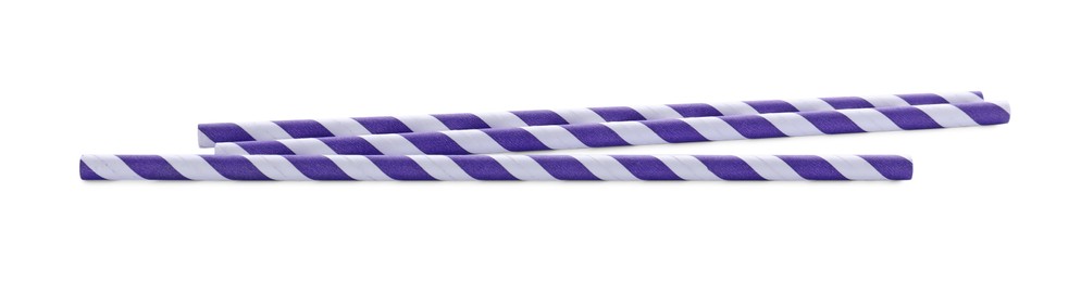 Photo of Striped paper cocktail straws on white background