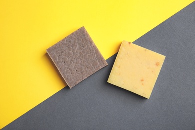 Photo of Hand made soap bars on color background, top view