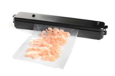 Photo of Vacuum packing sealer and plastic bag with shrimps on white background