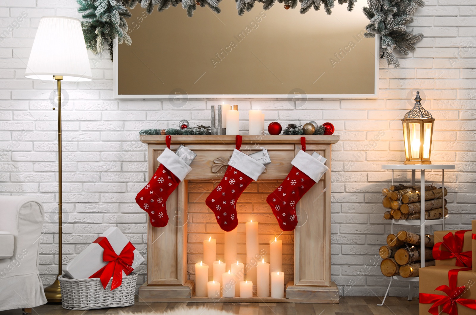 Photo of Decorative fireplace in stylish room interior. Christmas celebration