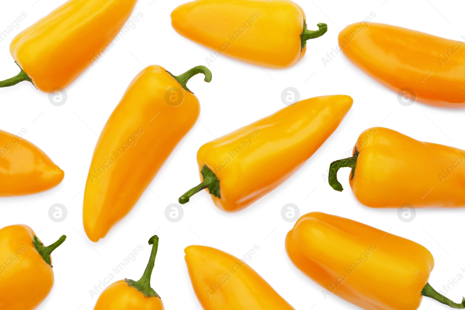 Photo of Many fresh raw orange hot chili peppers on white background, flat lay