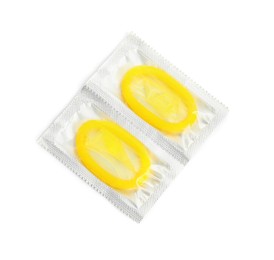 Photo of Condom packages on white background, top view. Safe sex