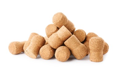 Heap of sparkling wine corks on white background