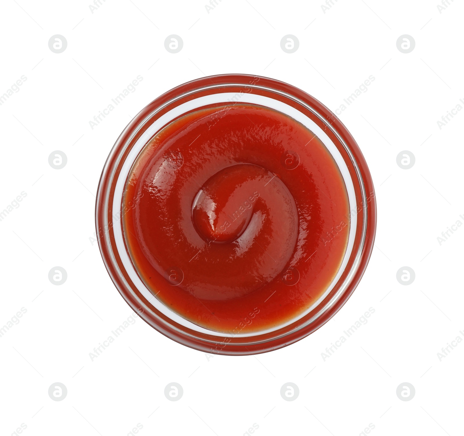 Photo of Glass bowl with tasty ketchup isolated on white, top view