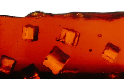 Closeup view of tasty refreshing cola with ice cubes on white background