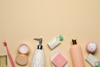 Bath accessories. Flat lay composition with personal care products on beige background, space for text