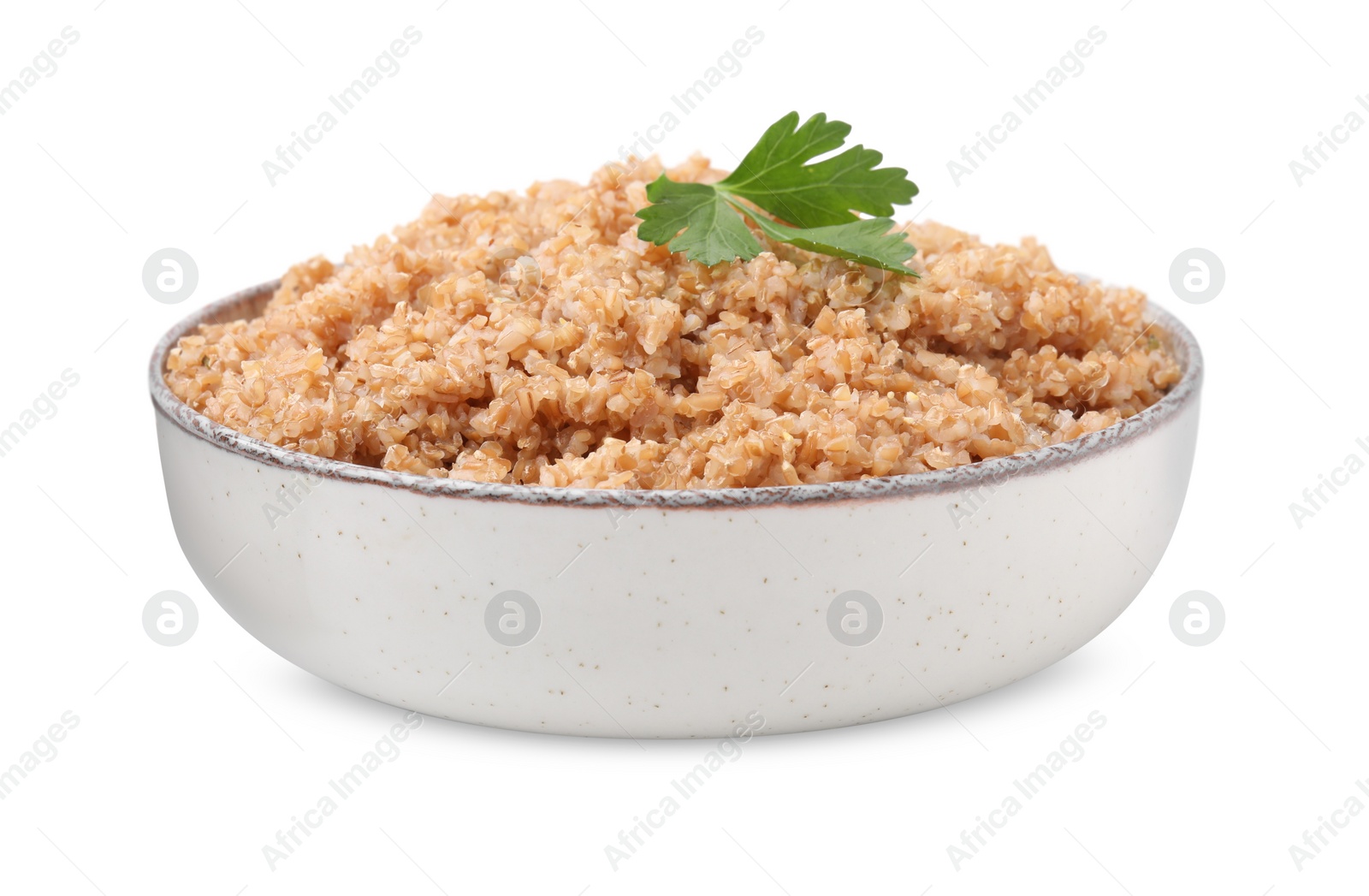 Tasty wheat porridge with parsley in bowl isolated on white Photo of Tasty wheat porridge with parsley in bowl isolated on white