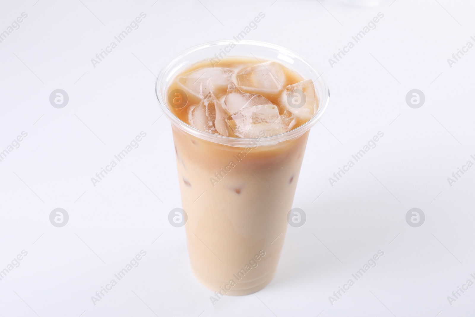 Photo of Plastic cup of fresh iced coffee isolated on white