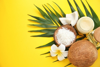 Photo of Beautiful composition with coconut oil and nuts on color background