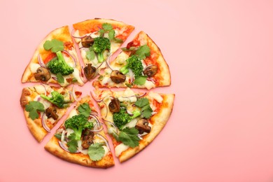 Photo of Delicious vegetarian pizza on pink table, top view. Space for text