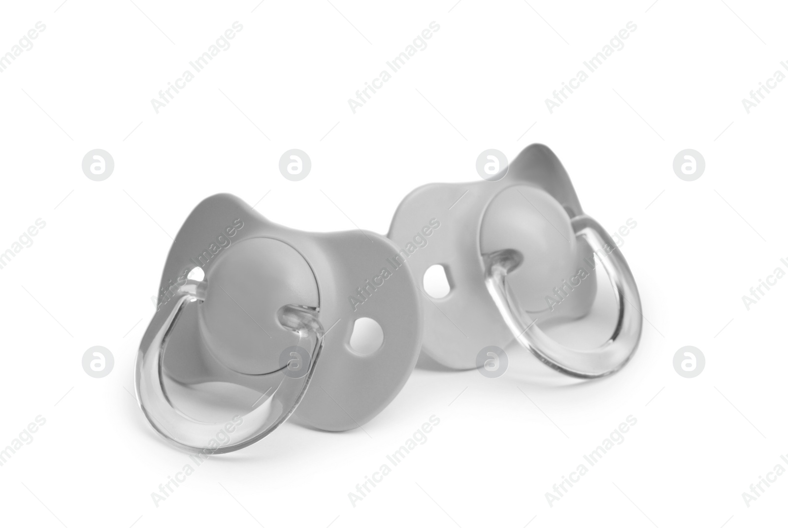 Photo of New grey baby pacifiers isolated on white