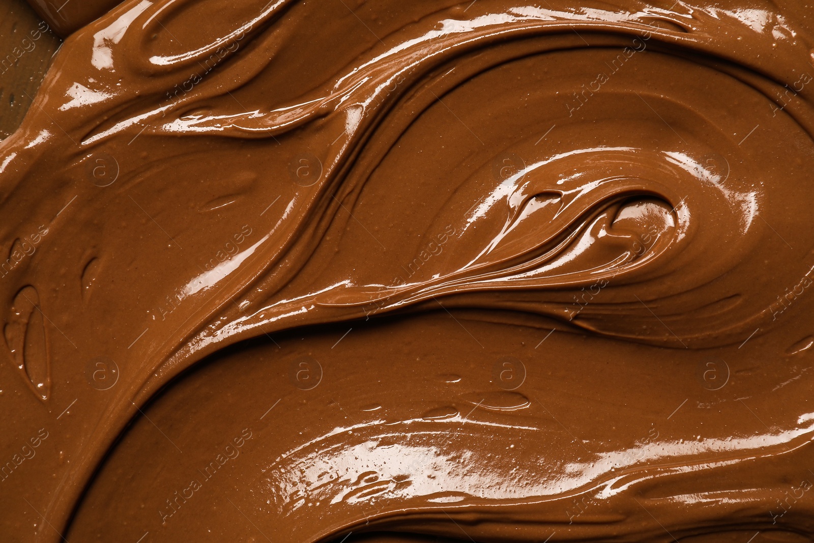 Photo of Tasty chocolate paste as background, closeup view