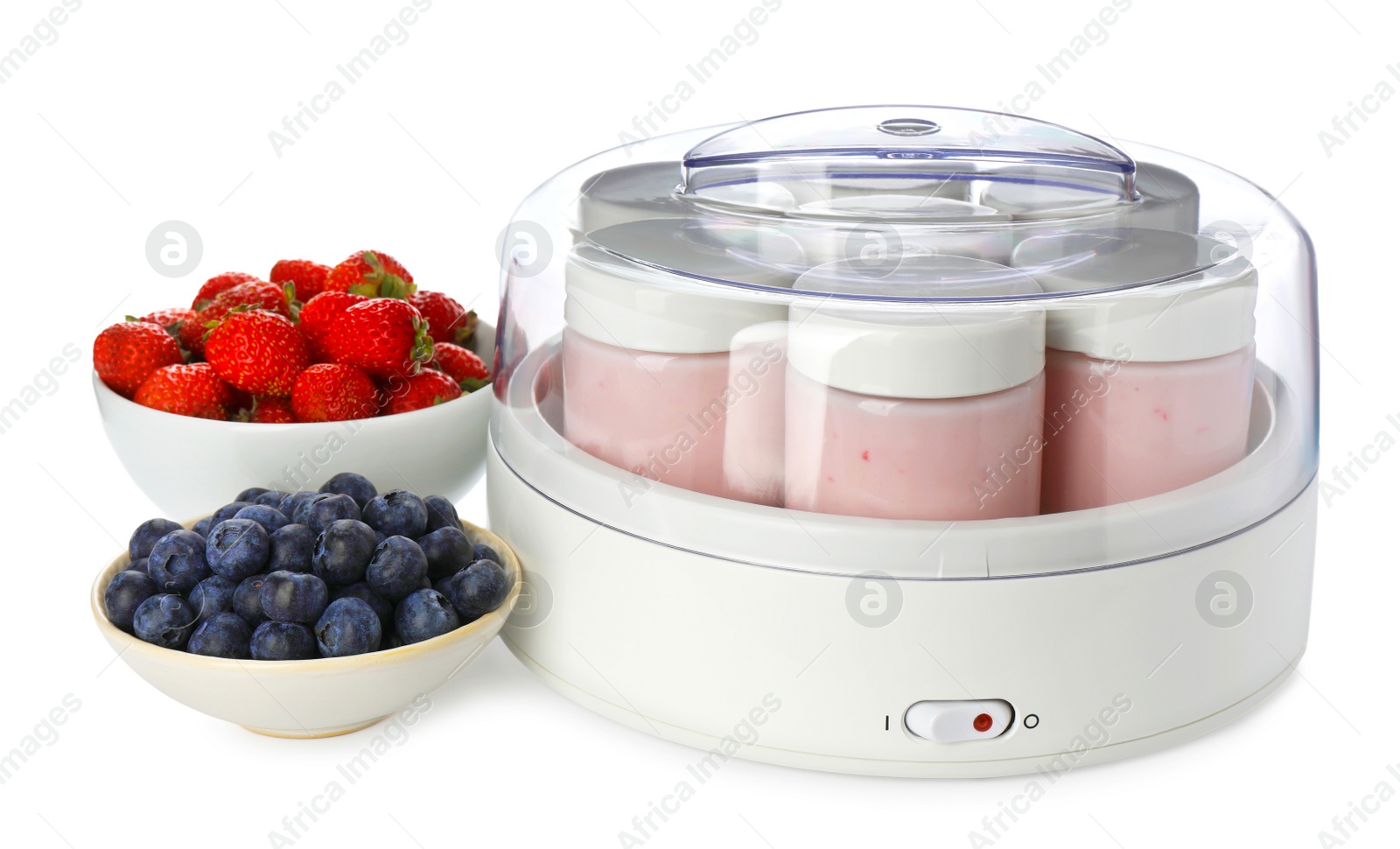 Photo of Modern yogurt maker with full jars and berries on white background