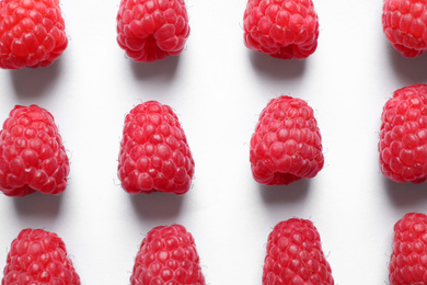 Photo of Fresh sweet ripe raspberries on white background, flat lay