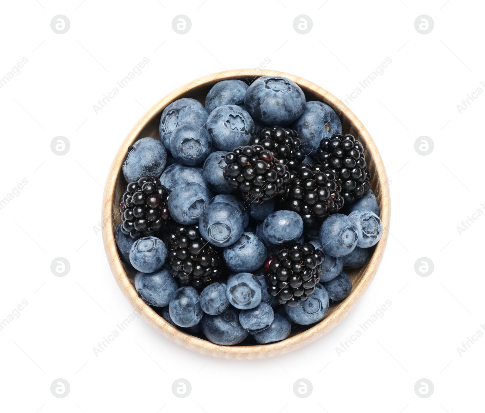 Photo of Blueberries and blackberries in bowl on white background, top view