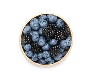 Blueberries and blackberries in bowl on white background, top view