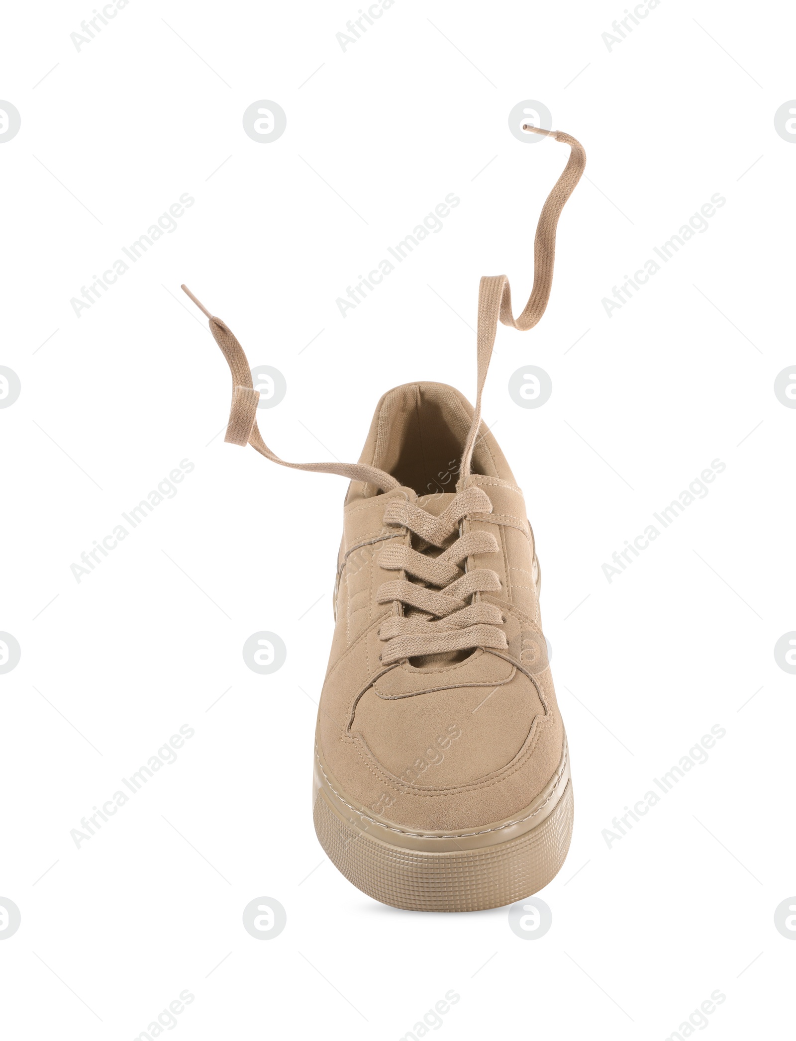 Photo of One stylish beige sneaker isolated on white