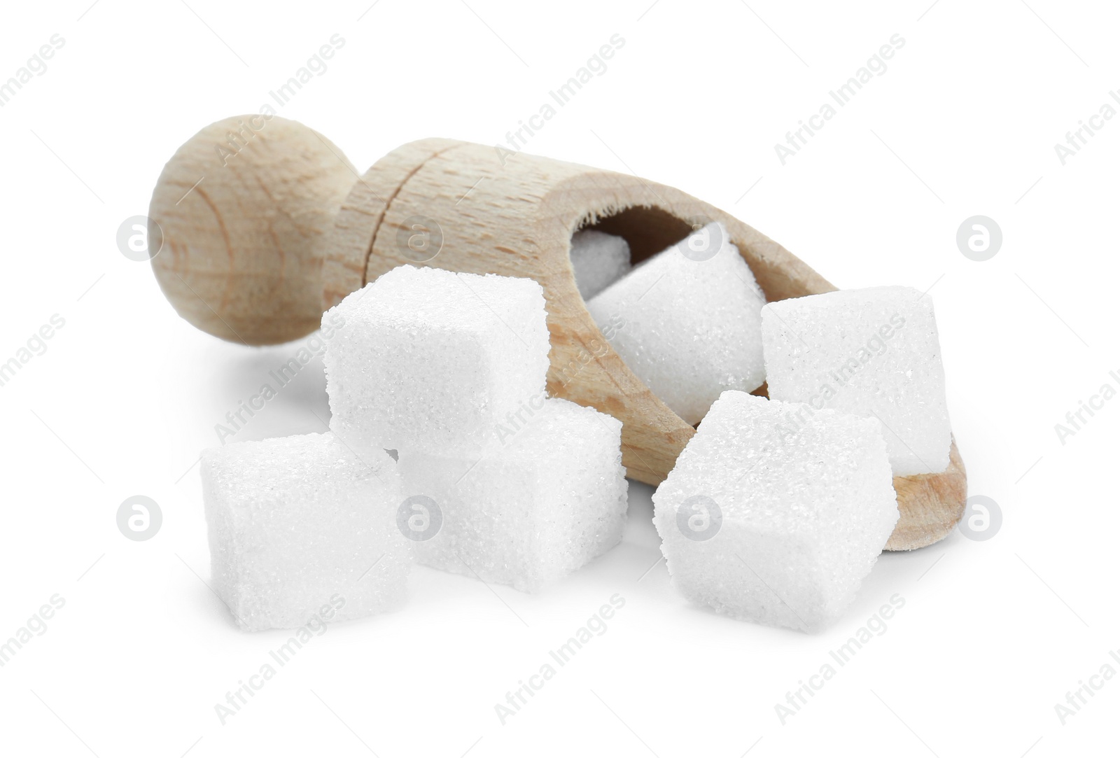 Photo of Sugar cubes and wooden scoop isolated on white