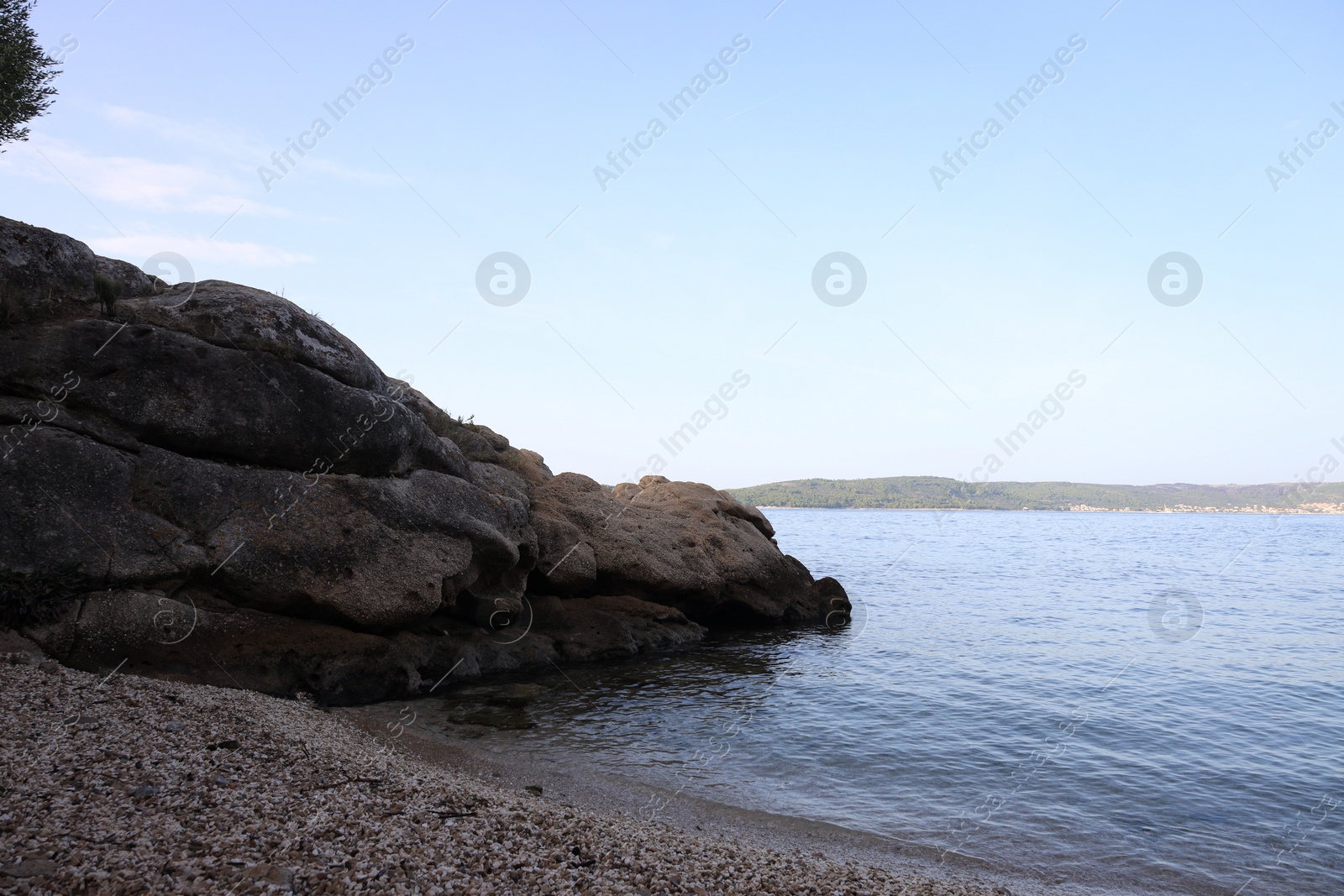 Photo of Beautiful clear sea and pebbles on beach