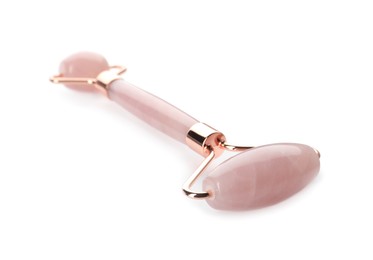 Photo of Rose quartz face roller on white background