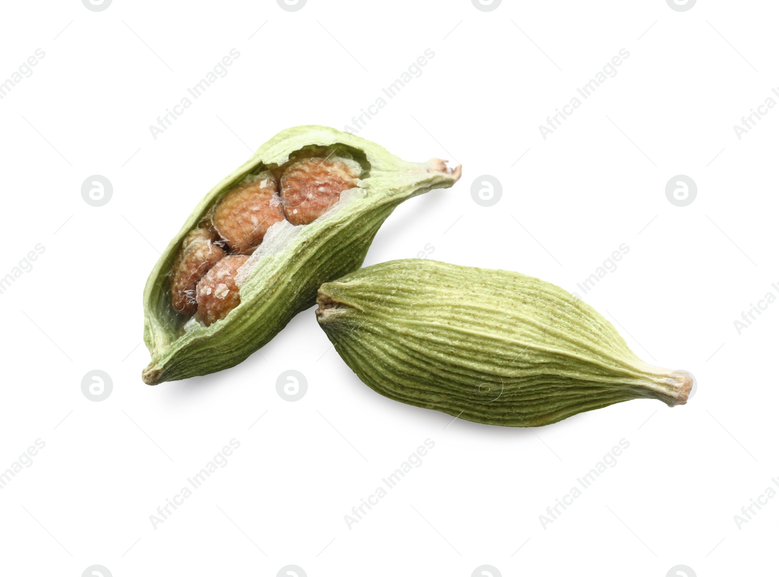 Photo of Dry green cardamom pods on white background, top view