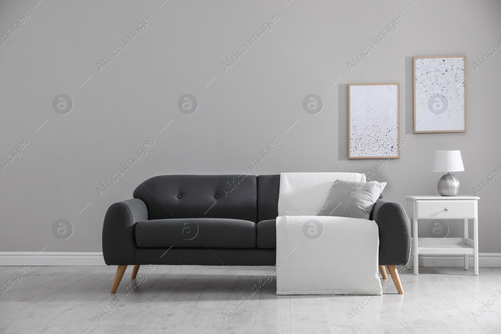 Photo of Stylish living room interior with comfortable sofa