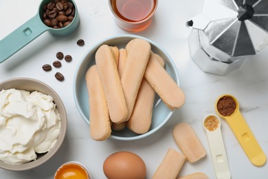 Photo of Flat lay composition with ingredients for tiramisu on white table