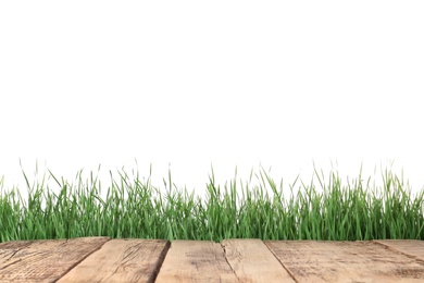 Wooden deck and green grass isolated on white