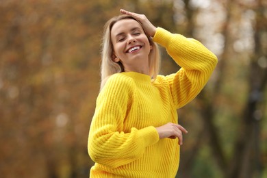 Photo of Autumn vibes. Portrait of happy woman outdoors