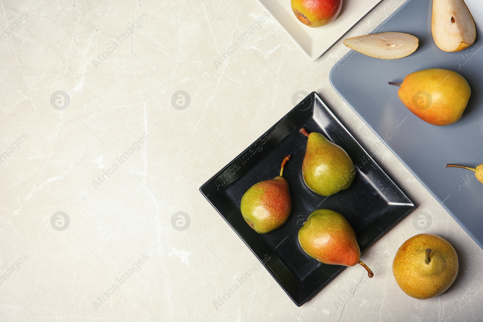 Photo of Flat lay composition with ripe pears on grey background. Space for text