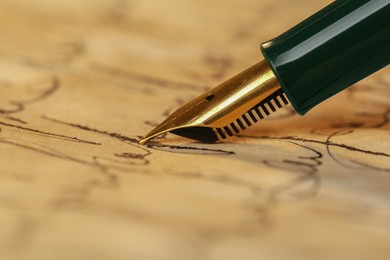 Photo of Woman writing letter with fountain pen, closeup