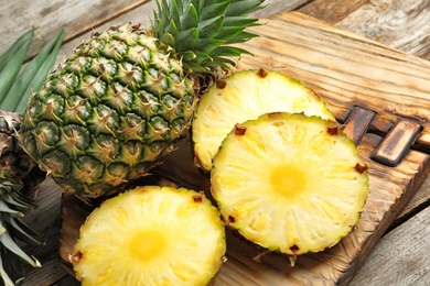 Photo of Fresh pineapple on wooden board