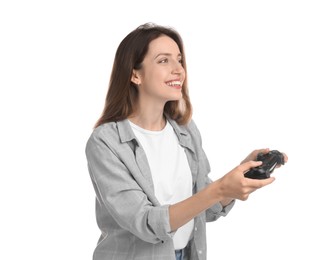 Happy woman playing video game with controller on white background