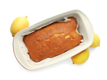 Tasty lemon cake in baking dish and citrus fruits isolated on white, top view