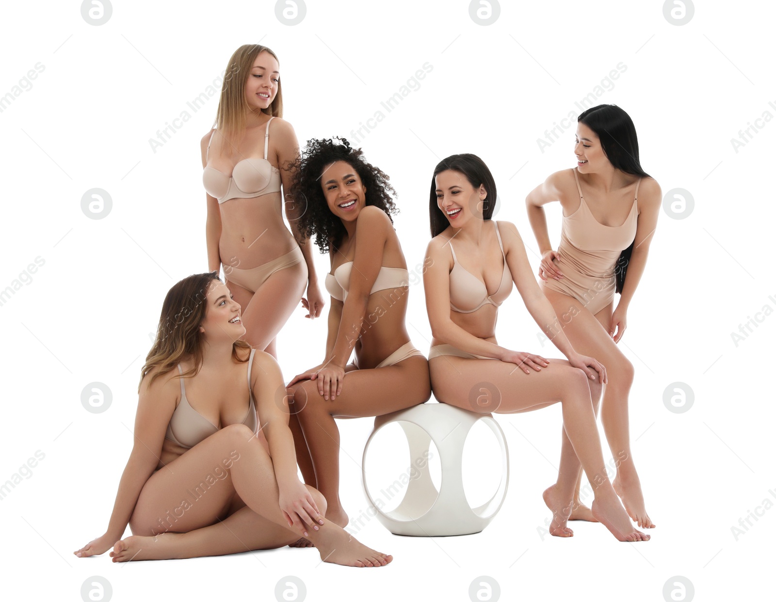 Photo of Group of women with different body types in underwear on white background